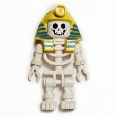 Minifigurka LEGO Skeleton, Standard Face, Mummy Headdress, Blue and Gold Stripes