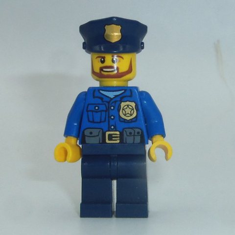 Minifigurka LEGO Policeman, Blue Shirt with Badge and Pouches, Dark Blue Legs, Dark Blue Police Hat with Badge, Beard