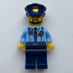 Minifigurka LEGO Policeman, Bright Light Blue Jacket with Zipper, Radio, Badge, and Tie, Dark Blue Legs, Dark Blue Police Hat with Badge, Beard