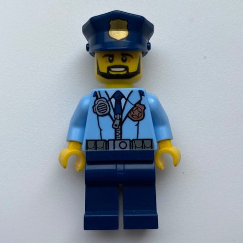 Minifigurka LEGO Policeman, Bright Light Blue Jacket with Zipper, Radio, Badge, and Tie, Dark Blue Legs, Dark Blue Police Hat with Badge, Beard
