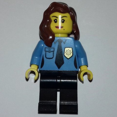 Minifigurka LEGO Policewoman, Medium Blue Shirt with Tie and Badge, Black Legs, Reddish Brown Hair