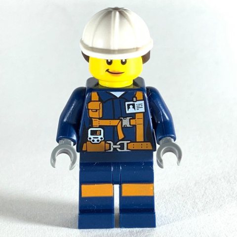 Minifigurka LEGO Miner, Woman, Dark Blue Jacket with Straps and ID Badge, White Hard Hat with Hair, Smirk