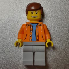 Minifigurka LEGO Man, Open Orange Jacket over Light Blue Shirt, Reddish Brown Hair