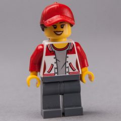 Minifigurka LEGO Woman, Red and White Letterman Jacket, Dark Bluish Gray Legs, Red Cap with Hair