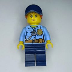 Minifigurka LEGO Policewoman, Bright Light Blue Shirt, Dark Blue Legs, Dark Blue Cap with Ponytail