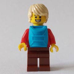 Minifigurka LEGO Man, Red Plaid Shirt, Reddish Brown Legs, Tan Hair, Backpack on Front