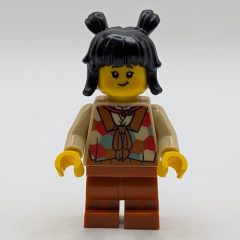 Minifigurka LEGO Tan Tunic, Dark Orange Medium Legs, Black Hair